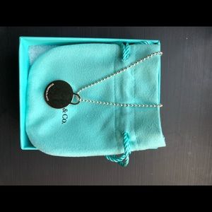 Tiffany co. round Pendant on 18” silver necklace